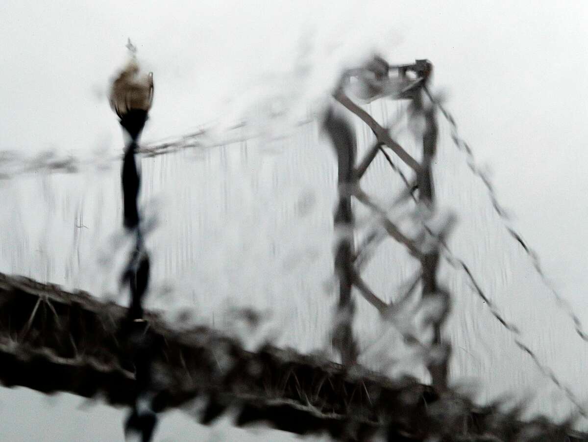 The westernmost tower of the Bay Bridge is seen through runny rain drops on the Embarcadero in San Francisco, Calif., Sunday, November 26, 2017, as a storm dropped several inches of rain throughout the bay