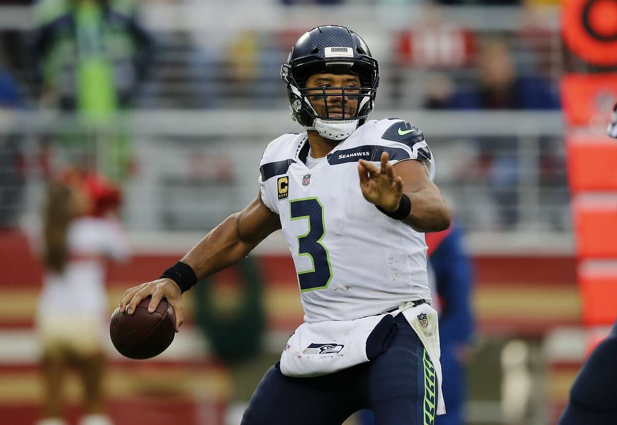 Seattle Seahawks quarterback Russell Wilson (3) throws against the San Francisco 49ers during the first half of an NFL football game Sunday, Nov. 26, 2017, in Santa Clara, Calif. (AP Photo/John Hefti)