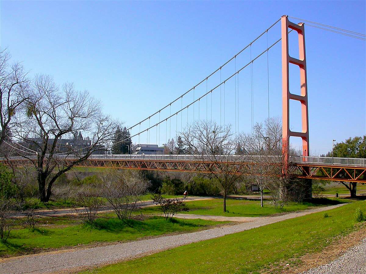 The American River Parkway, great for road biking, passes a miniature suspension bridge in its 32.8-mile route from Folsom Lake to Discovery Park near Old Town Sacramento.