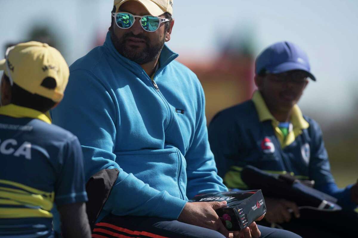 Master Strokes coach and a member of the United States national cricket team Sushil Nadkarni, center, sits with his players during a cricket match, Sunday, Nov. 19, 2017, in Katy. ( Marie D. De Jesus / Houston Chronicle )