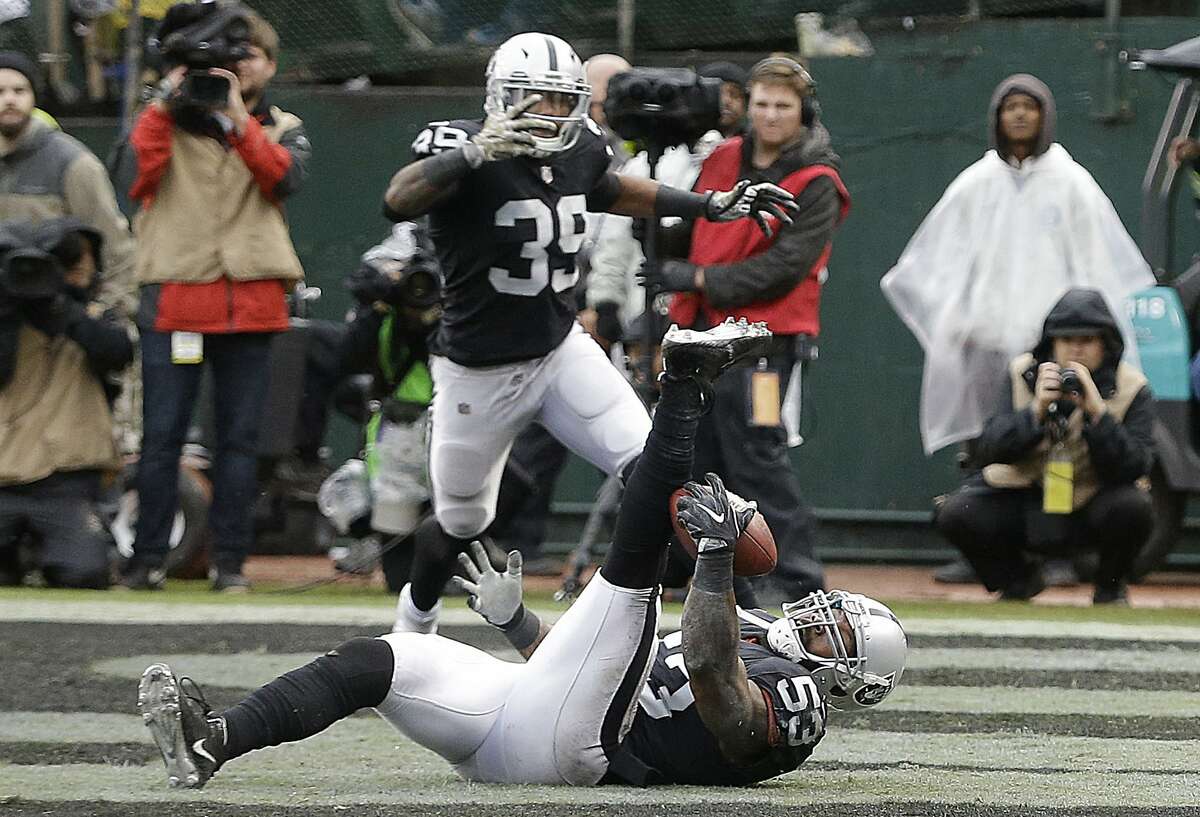 Oakland Raiders linebacker NaVorro Bowman (53) intercepts a pass in the end zone during the first half of an NFL football game against the Denver Broncos in Oakland, Calif., Sunday, Nov. 26, 2017. (AP Photo/Ben Margot)