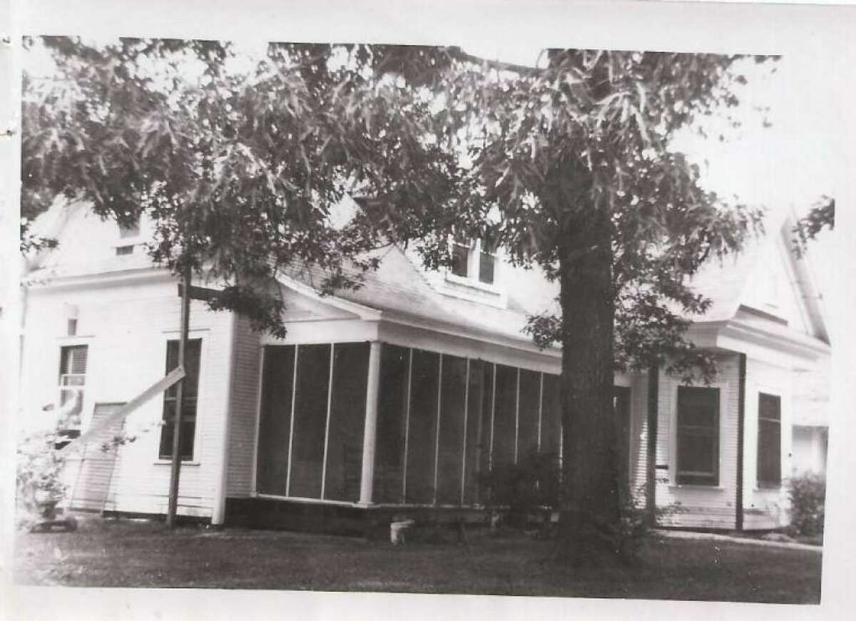 This photo of the Laura Grogan Cochran House shows the screened in front porch about the time Fred Cochran Sr. moved into Laura Grogan Cochran's home (his mother). The house was built for Nancy Lewis Grogan, widow to Richard Grogan, in about 1918 soon after the Grogan Cochran Lumber Company was established near Conroe. Today it is used for the Villa Italia restaurant at the corner of Thompson and Cochran streets. When the house was built, it was on the edge of Conroe, so the story goes that the street was called Cochran.