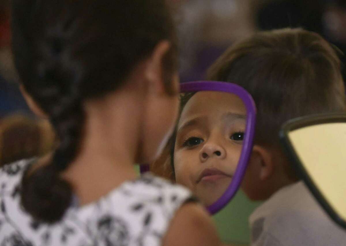 Lailah Gonzalez looks at herself in a mirror at the Pre-K 4 SA North Education Center on Feb. 28.