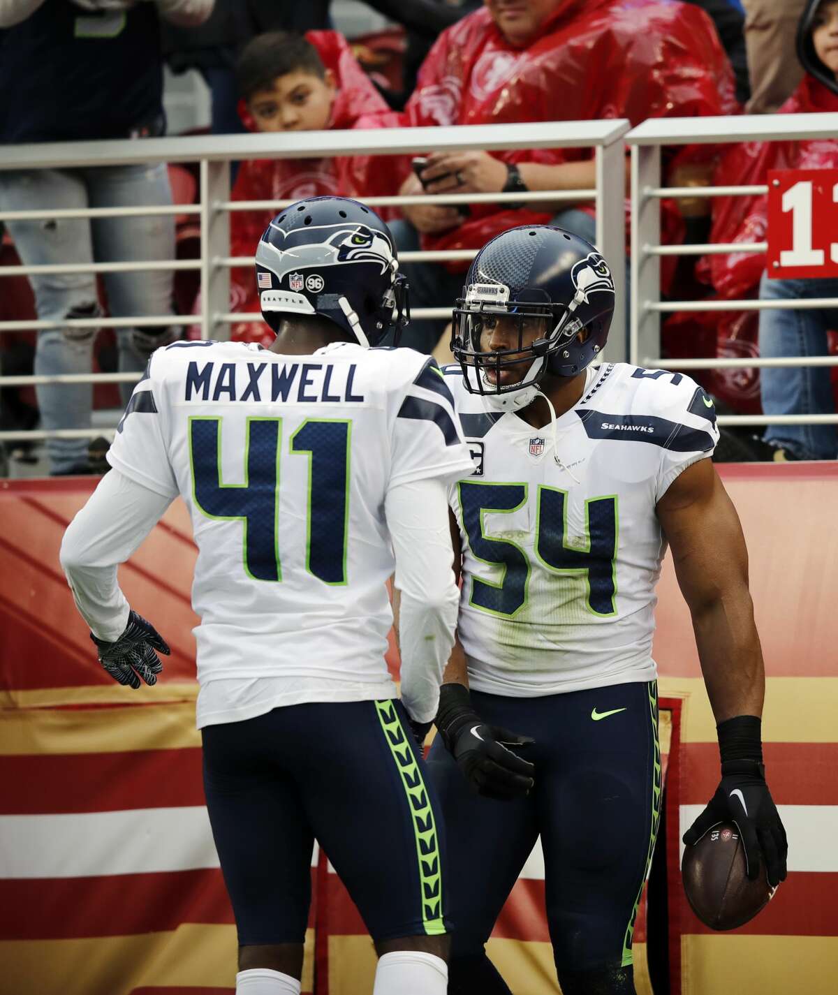Seattle Seahawks middle linebacker Bobby Wagner (54) celebrates after intercepting a pass with teammate Byron Maxwell (41) during the first half of an NFL football game against the San Francisco 49ers Sunday, Nov. 26, 2017, in Santa Clara, Calif. (AP Photo/John Hefti)