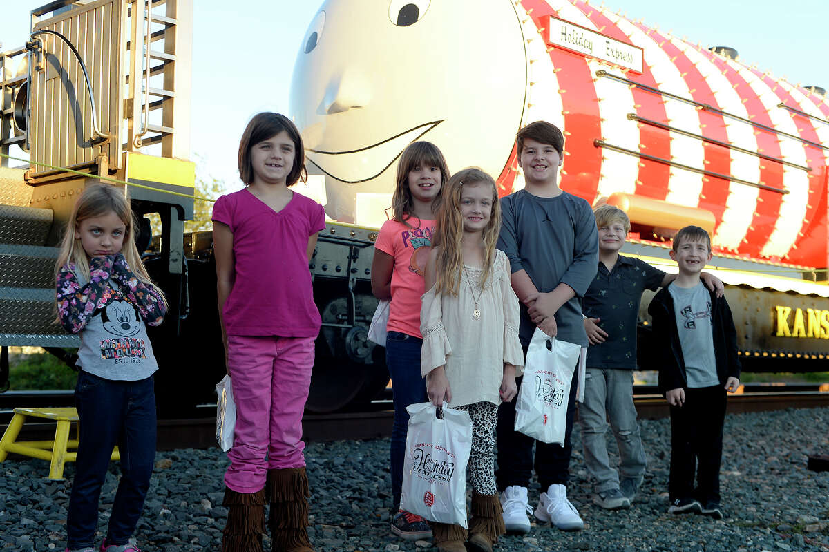 A group of children at the Kansas City Southern Holiday Express stop in Beaumont on Monday evening. The Christmas rail cars are traveling through six states this year, with KCS donating money to the local Salvation Army in each of the 22 cities they'll visit. Photo taken Monday 11/27/17 Ryan Pelham/The Enterprise