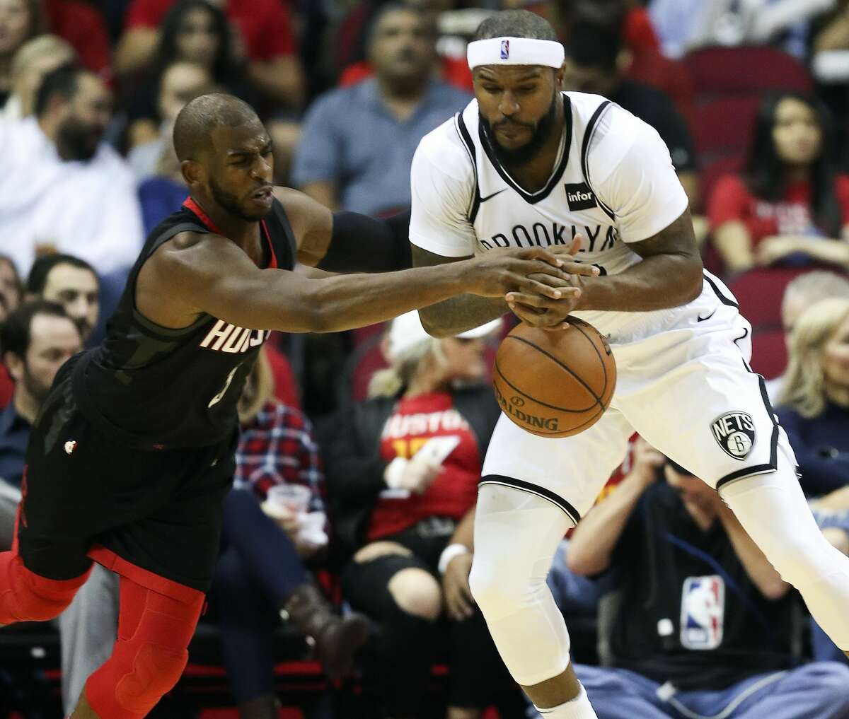 Houston Rockets guard Chris Paul, left, steals the ball from Brooklyn Nets forward Trevor Booker during the first half of an NBA basketball game, Monday, Nov. 27, 2017, in Houston. (AP Photo/Eric Christian Smith)