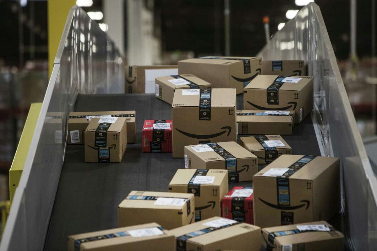 Packages move along a conveyer belt at the Amazon.com fulfillment center in Robbinsville, N.J.