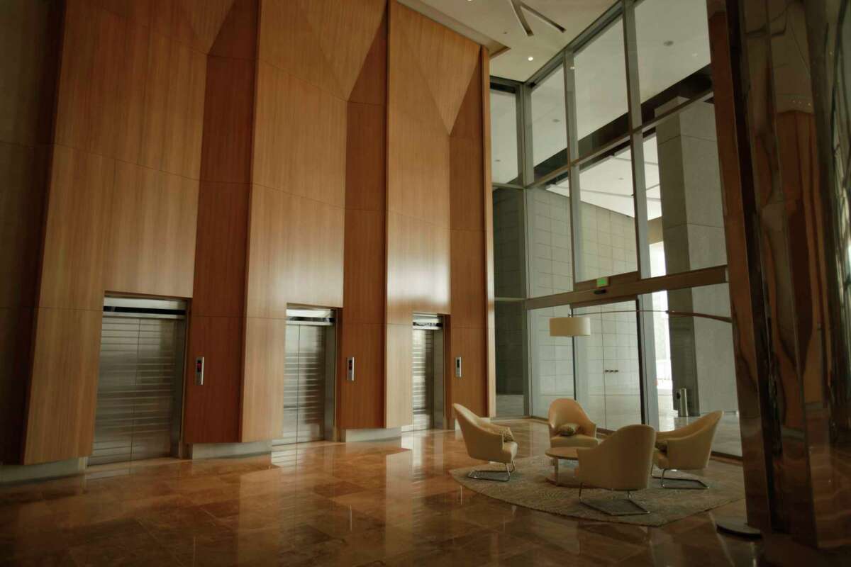 FILE - This July 4, 2011, file photo shows the lobby at the Trump Ocean Club International Hotel and Tower in Panama City. Owners are working to strip President Donald TrumpÂ?’s name from the 70-story building and fire the hotel management company run by TrumpÂ?’s family. The property once paid at least $32 million to associate with Trump.(AP Photo/Arnulfo Franco, File)