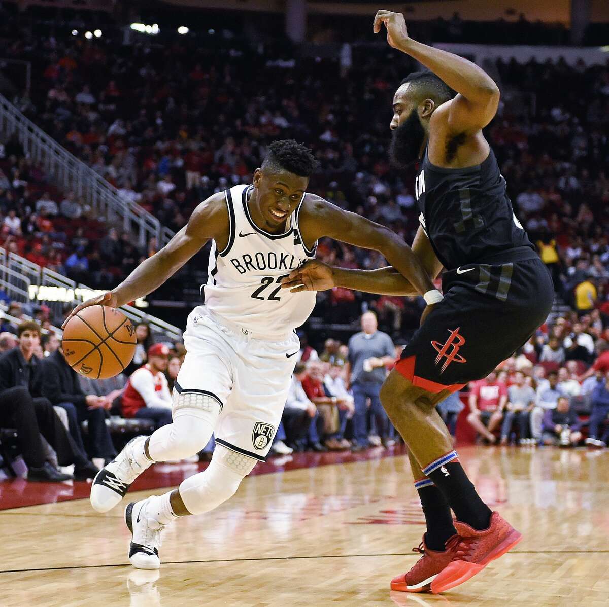 Brooklyn Nets guard Caris LeVert (22) drives past Houston Rockets guard James Harden during the second half of an NBA basketball game, Monday, Nov. 27, 2017, in Houston. Houston won the game 117-103. (AP Photo/Eric Christian Smith)