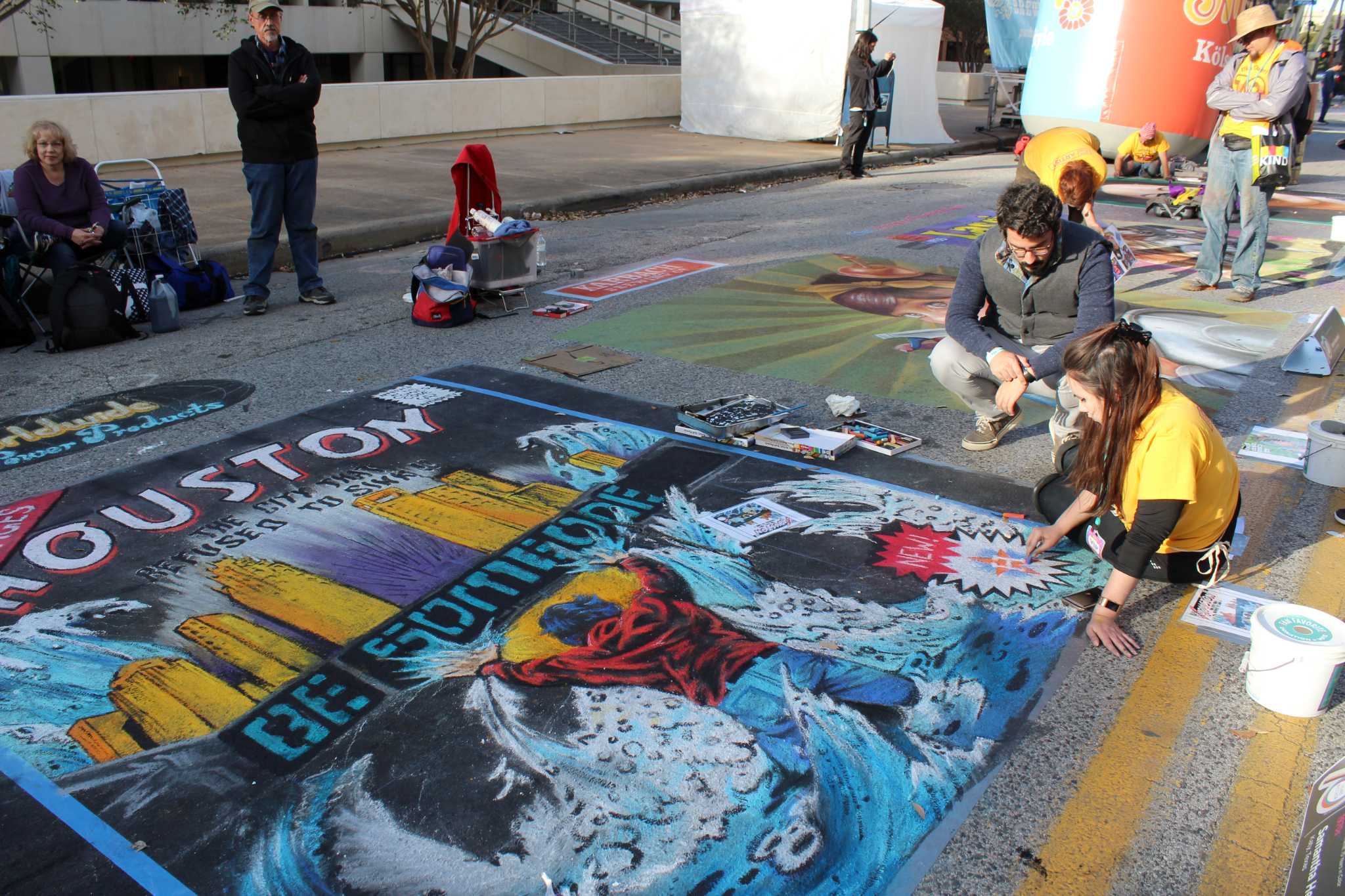 Local artists create elaborate sidewalk murals to help children with