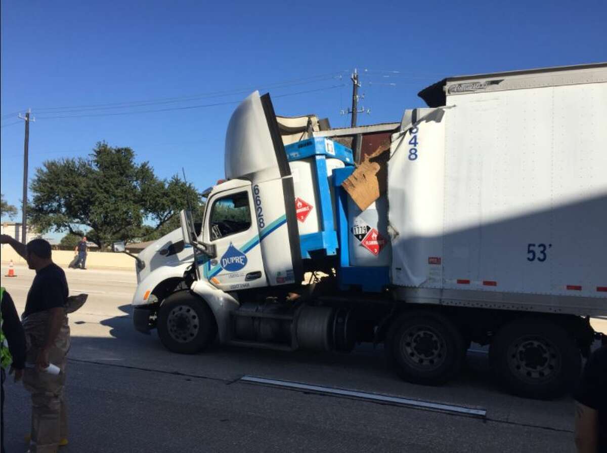 An 18-wheeler carrying sulfuric acid crashed Tuesday on Interstate 10, shutting down westbound lanes of the highway for hours.