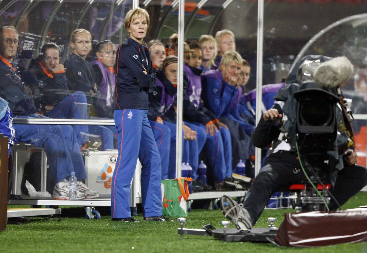 Netherlands' head coach Vera Pauw, standing, the Houston Dash's new coach, is seen during their quarter final Women's Euro 2009 soccer match against France in Tampere, Finland, Thursday evening, Sept. 3, 2009. The Women's European soccer championships take place in Finland from Aug. 23 to Sept. 10, 2009. (AP Photo/Matthias Schrader)