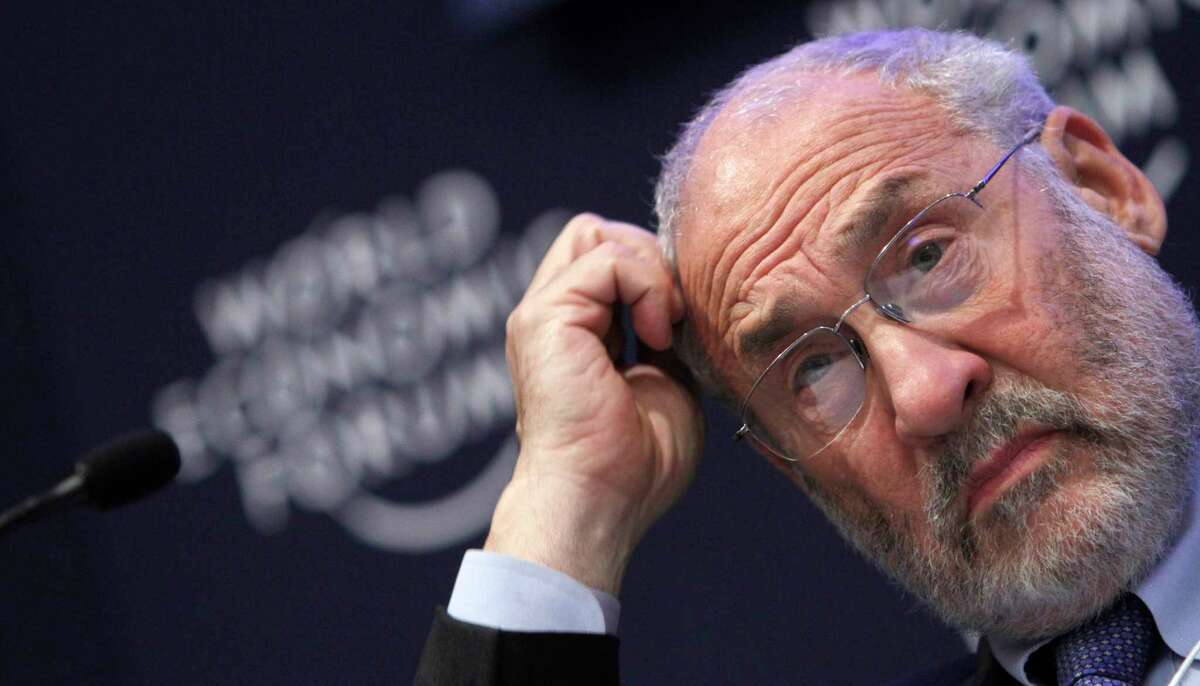 In this Jan. 26, 2011 file photo, Columbia University professor Joseph Stiglitz scratches his head during a session at the World Economic Forum in Davos, Switzerland. Stiglitz and others worry that too much money flowing to developing economies will form bubbles in stocks and housing prices that could burst. Such money has already inflated worldwide commodity prices to historic levels. (AP Photo/Virginia Mayo, file)
