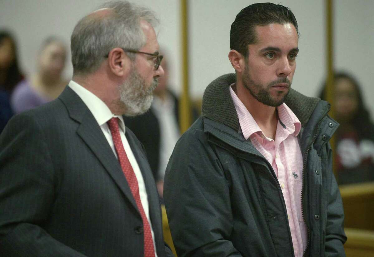 Attorney Christian Bujdud accopnaies Daniel Moran, 33, of Norwalk, as he is arraigned on conspiracy to commit illegal taking of a black bear Thursday, November 30, 2017, at Norwalk Superior Court in Norwalk, Conn. Antonio Lio, 28, of Wilton, was also arraigned Thursday on two counts of illegal taking of a black bear and fourth-degree negligent hunting and The DEEP’s Environmental Conservation Police arrested the two individuals on Saturday, September 16, 2017, following the killing of the bear.