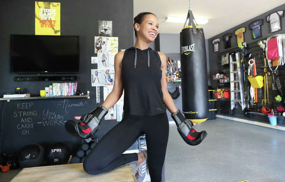 KHOU 11 Anchor Mia Gradney decided to turn her garage into a gym is photographed Tuesday, Nov. 28, 2017, in Fort Bend County. She has a weight bench, a spin bike and other equipment and says you don't need a lot of money to have a home gym. ( Steve Gonzales / Houston Chronicle )