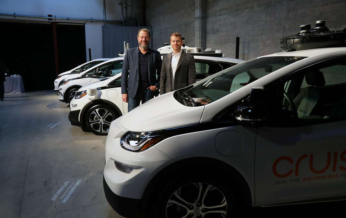 Dan Ammann, left, General Motors� president, and Kyle Vogt, chief executive of Cruise Automation, pose with cars in the test fleet in San Francisco on Nov. 28, 2017. GM�s pursuit of autonomous-driving technology led the automaker to acquire Cruise, a start-up focused on the field. (Jim Wilson/The New York Times)