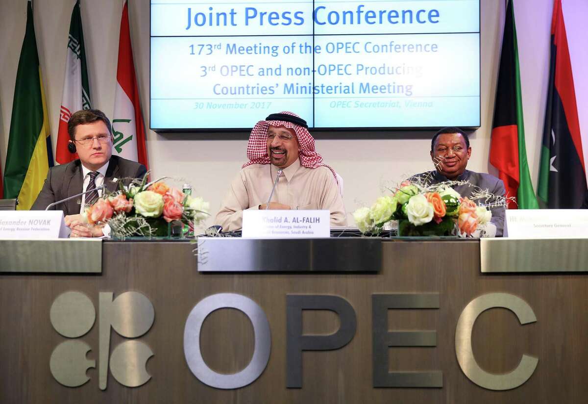 Alexander Novak, Russia's energy minister, left, and Mohammed Barkindo, secretary general of the Organization of Petroleum Exporting Countries (OPEC), right, look on as Khalid Al-Falih, Saudi Arabia's energy and industry minister, reacts during a news conference in Vienna, Austria.