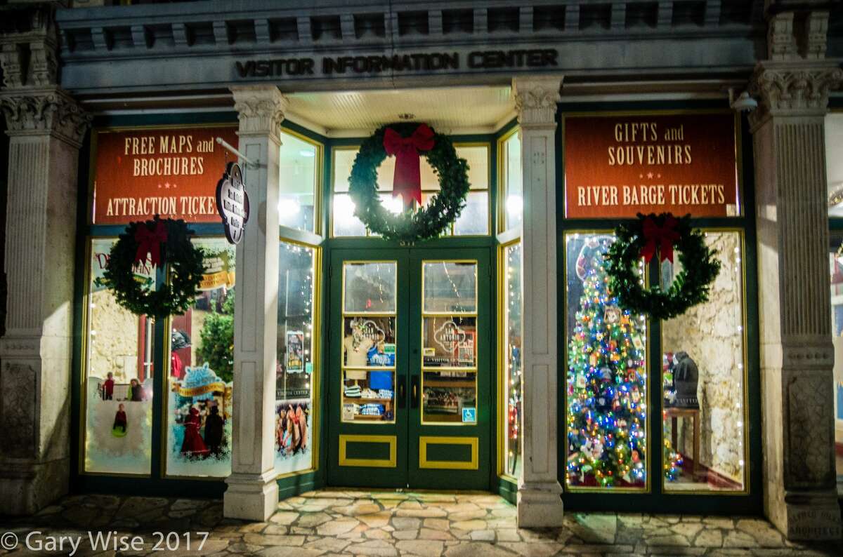 Photos show various buildings, businesses, parks and areas around San Antonio illuminated with lights for the mayor's "Light It Up Downtown" holiday contest. The contest goes until Dec. 20, 2017.