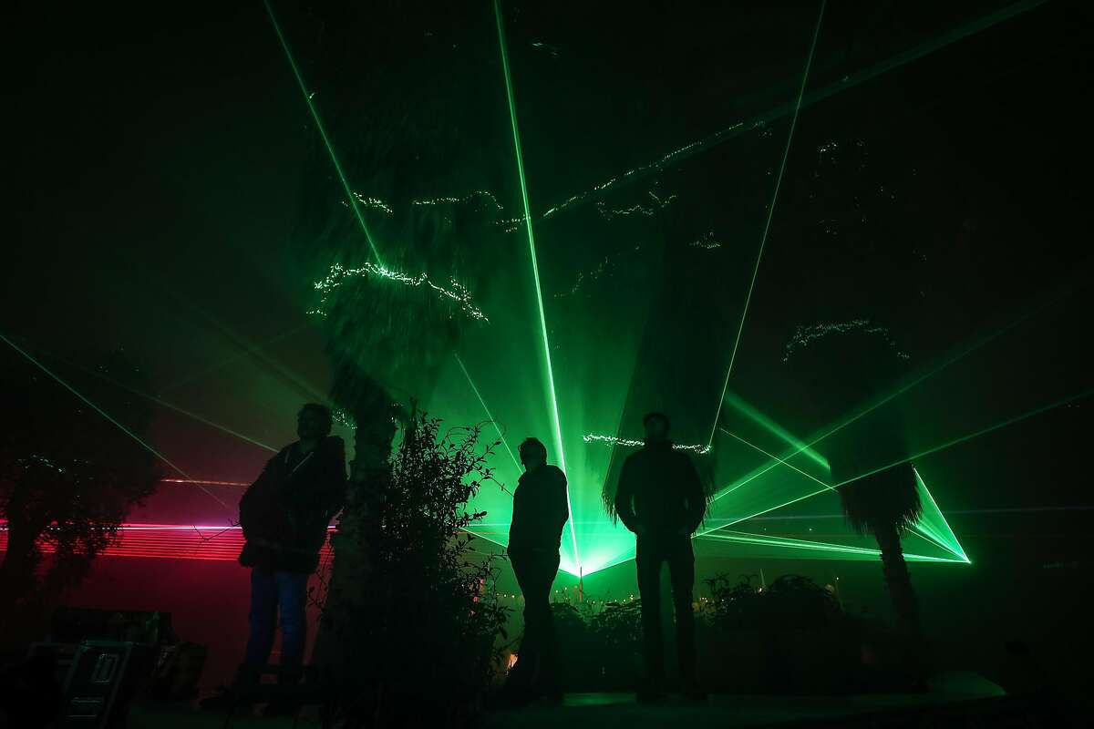 Laser light displays have become a popular time-saving alternative to hanging Christmas lights outside homes.  (Photo by Matt Cardy/Getty Images)