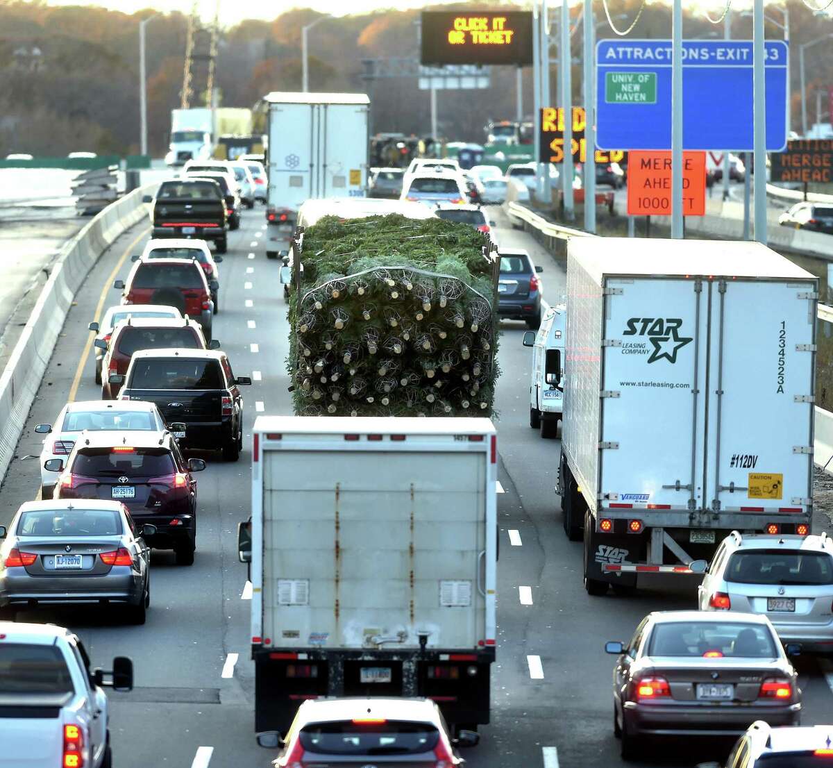 A truck carrying Christmas trees travels south on I-95 through New Haven on November 22, 2017.