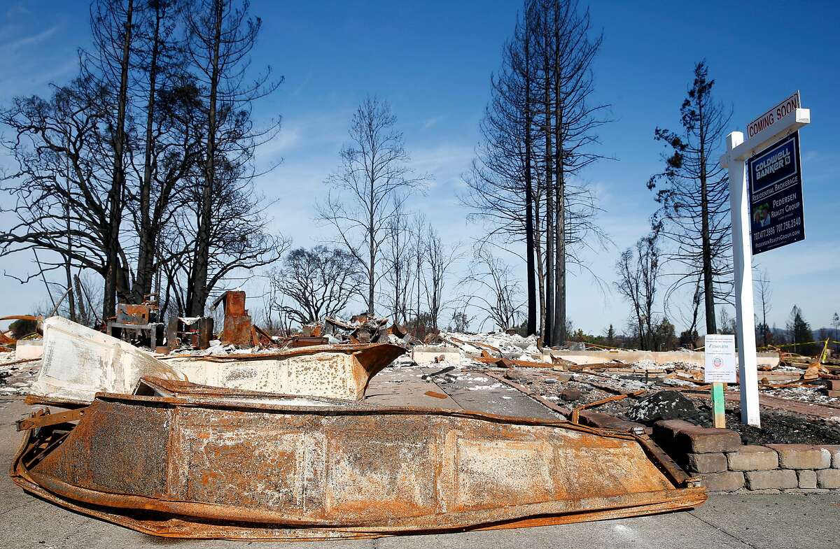 A residential lot at 1673 Hopper Avenue in the Coffey Park neighborhood and destroyed in last month's Tubbs Fire is listed for sale in Santa Rosa, Calif. on Thursday, Nov. 30, 2017.