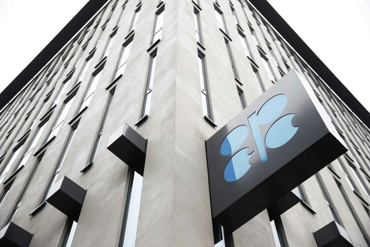 An OPEC sign hangs outside the OPEC Secretariat ahead of the 173rd Organization of Petroleum Exporting Countries (OPEC) meeting in Vienna, Austria, on Wednesday, Nov. 29, 2017. OPEC and Russia are said to have agreed they should extend oil-supply cuts deeper into next year, butÂ Moscow wants clarity on anÂ exit strategyÂ before giving formal consent. Photographer: Akos Stiller/Bloomberg