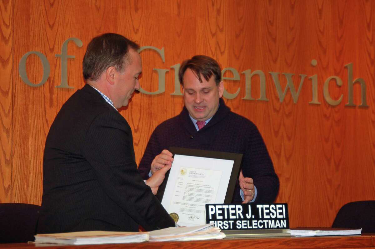 First Selectman Peter Tesei, left, presents a proclamation to Selectman Drew Marzullo Thursday at Town Hall. The citation declared Nov. 30, 2017 to be Drew Marzullo Day in Greenwich.