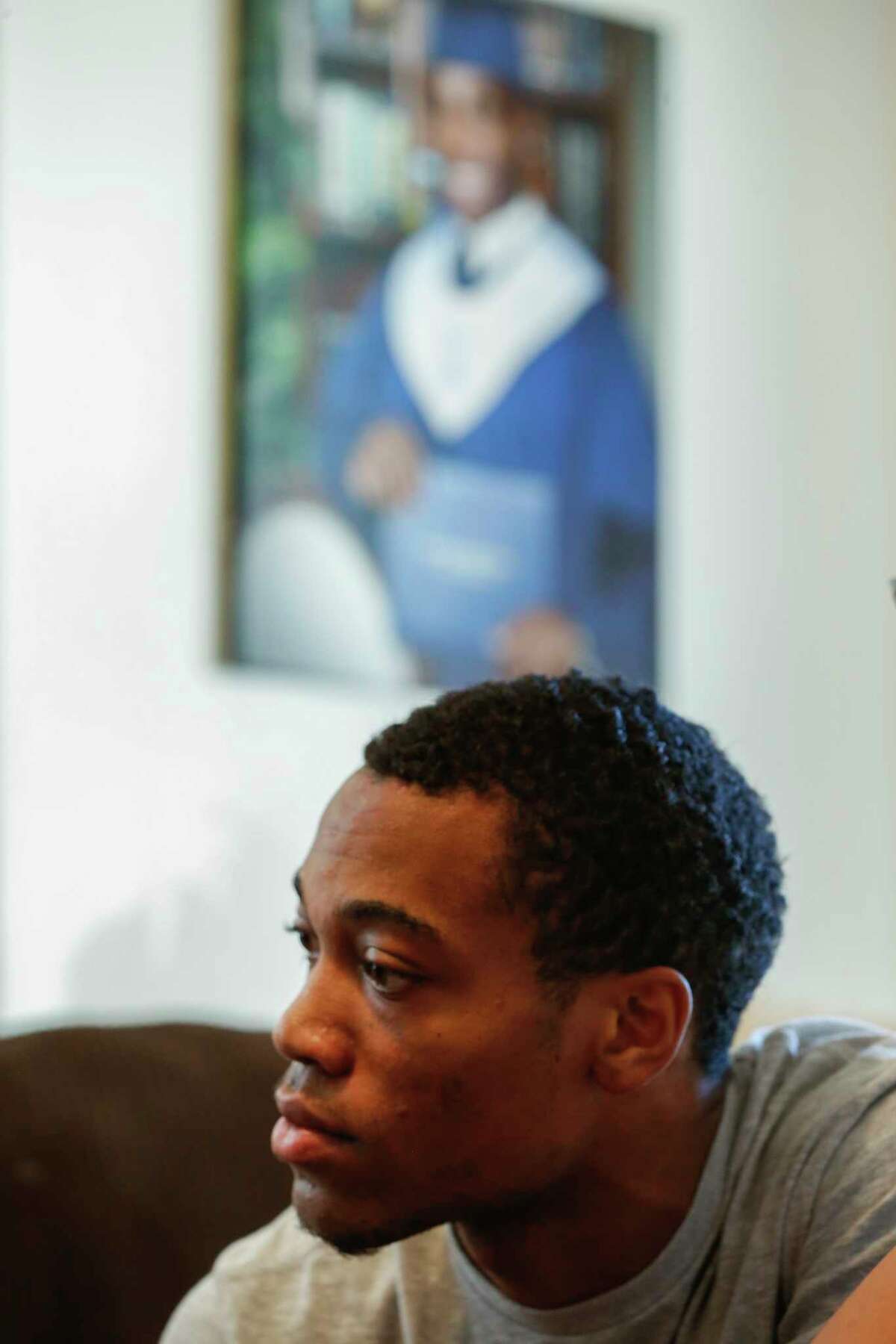 A'Vonta Williams listens to Harris County Sheriff Ed Gonzalez as he visits with him at his mother's home Thursday, November 30, 2017 in Houston. On August 30, a man driving a pickup truck shot at the car A'Vonta Williams was riding in, striking him in the legs and his girlfriend's diabetic grandmother in the bladder. Both were airlifted to the hospital. Thursday is three months since the incident and nobody from HCSO has interviewed the victims. A'Vonta, 21, was a security guard and aspiring boxer and state trooper who said responding deputies and constables didn't render aid and peppered him with questions about who he was beefing with and if he was a gang member. Williams was a high school law enforcement explorer who appears to have no criminal record. He can't work and his mother quit her job to care for him. They're most concerned about how the lack of aid intensified the injuries and that the case hasn't been thoroughly investigated, so a public shooter is still on the loose.