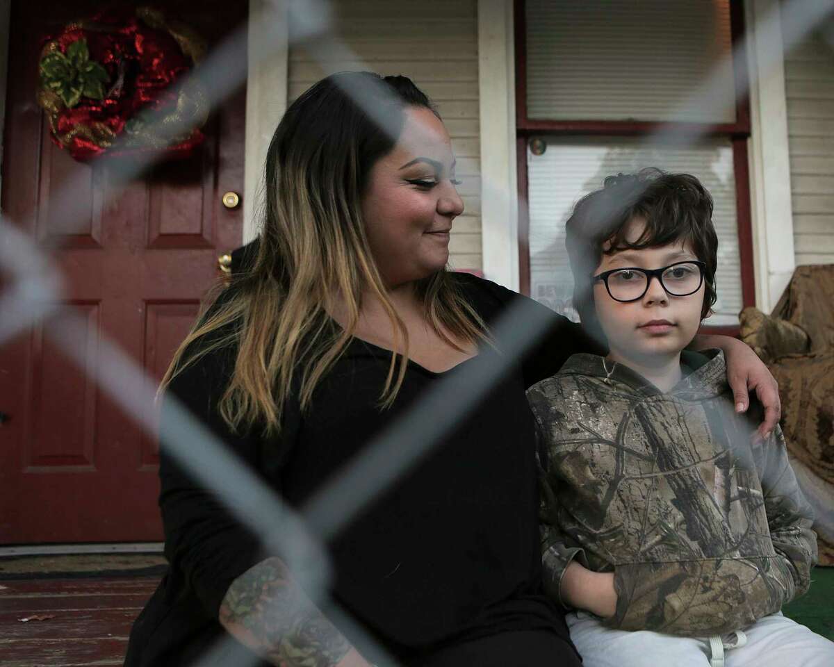 Lauren Kribbs in her Houston home with her son, Hunter Pruitt, 10, on Thursday, Nov. 30, 2017, in Houston. Kribbs has had multiple packages, which include Christmas presents for her son stolen from her porch. ( Elizabeth Conley / Houston Chronicle )