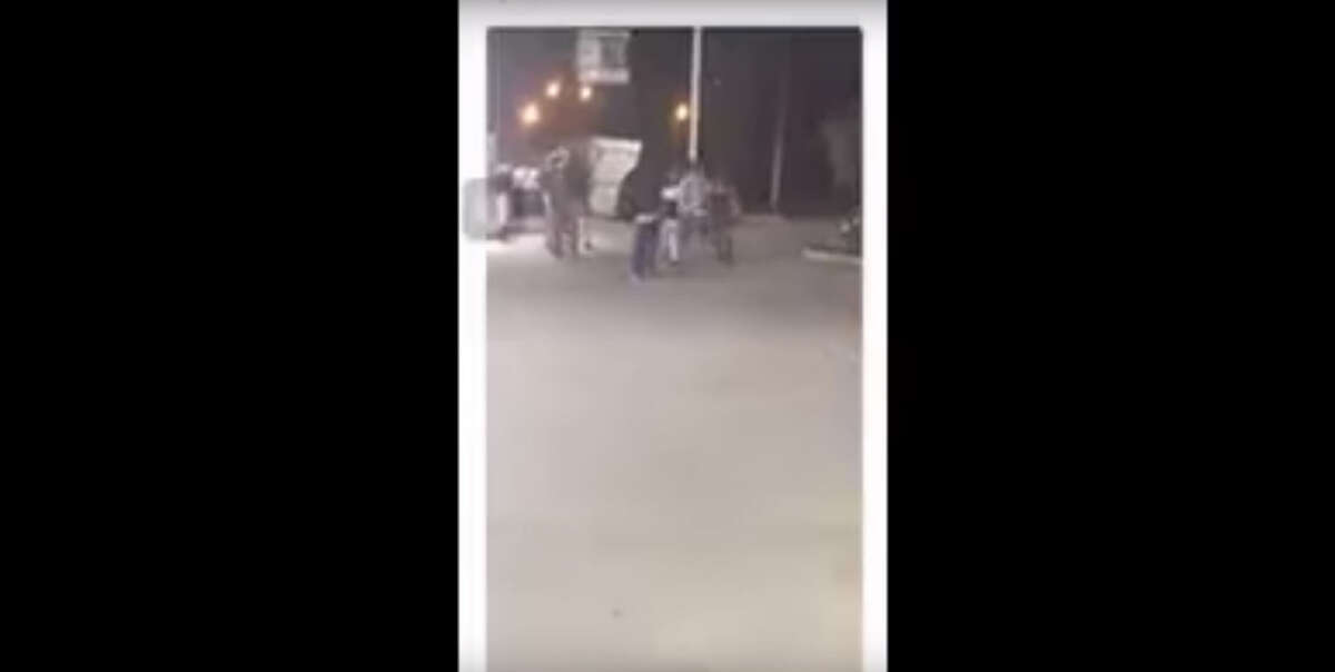 The graphic social media video was released by the Houston Police Department and appears to show the altercation prior to the shooting of Oscar Green, 47. The portion of the video showing Green's dead body lying on the pavement has been edited out by Chron.com.