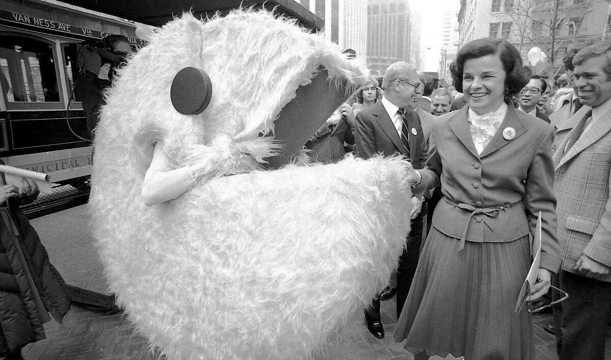 San Francisco mayor Dianne Feinstein accepts $1 million from Atari Corp. to the Save the Cable Cars fund on March 11, 1982. She tested an Atari computer and met a life-size Pac-Man character.