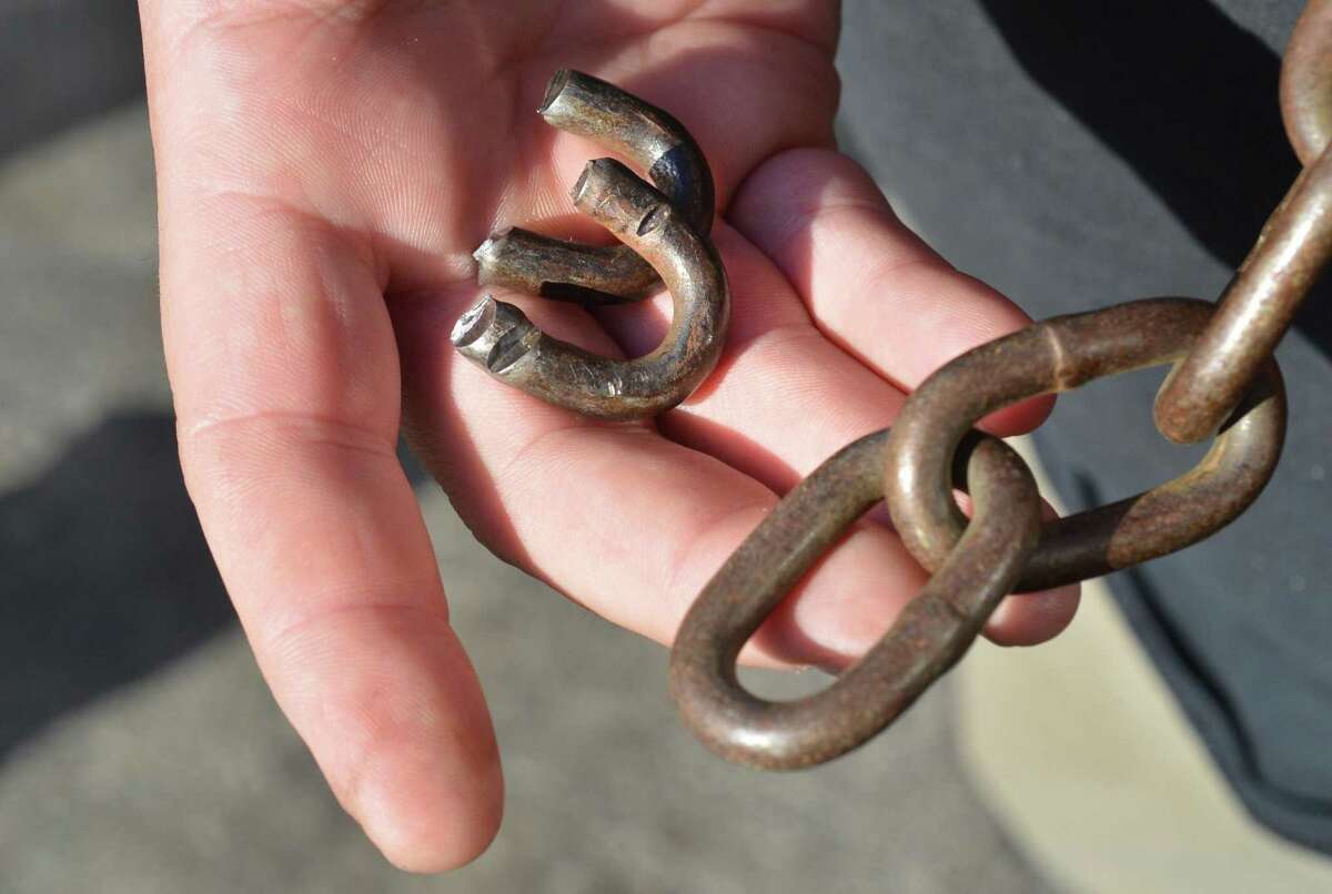 Broken links from a chain that locked the impound lot for Fedor Auto Body Works. The company alleges Norwalk police overstepped their authority by coming onto their property at 32 Woodward Ave., breaking open locked gate and removing vehicle that had been towed from the Main Avenue Stop & Shop.