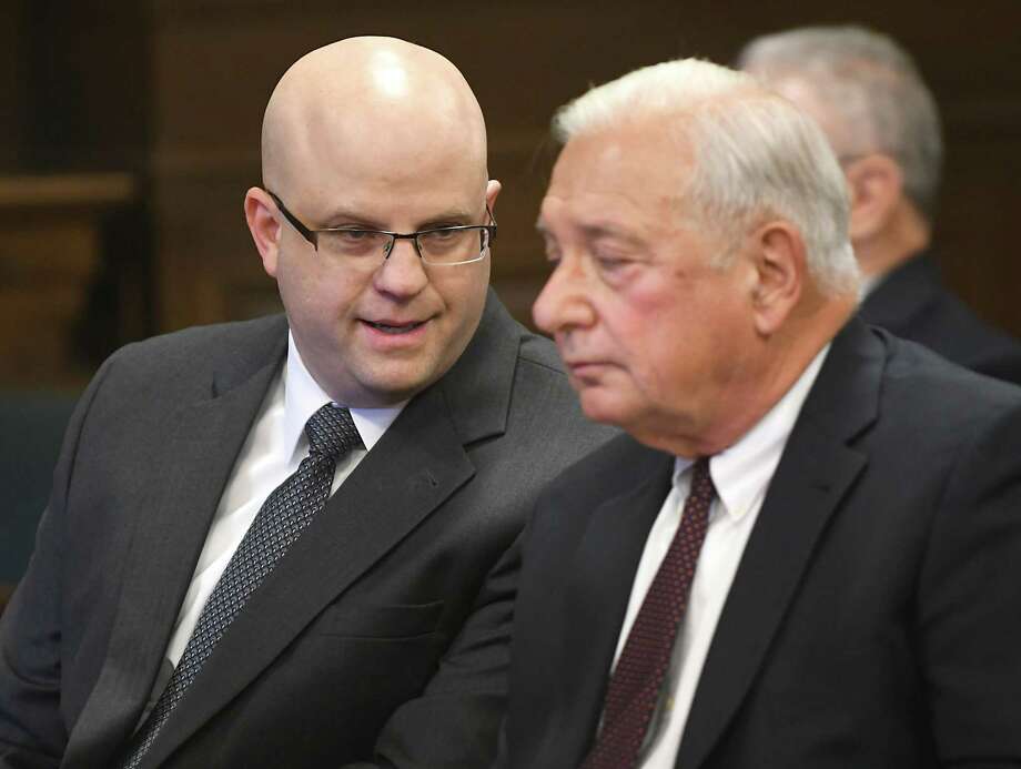 Rensselaer County District Attorney Joel Abelove, left, talks to his attorney William Dreyer before Columbia County Court Judge Jonathan Nichols indicts Abelove on two official misconduct charges and one charge of 1st degree perjury for his handling of an April 2016 fatal shooting by Troy Police Sgt. Randall French of Edson Thevenin at the Rensselaer County Court House on Friday, Dec. 1, 2017, in Troy, N.Y. (Lori Van Buren / Times Union) Photo: Lori Van Buren / 20042258A