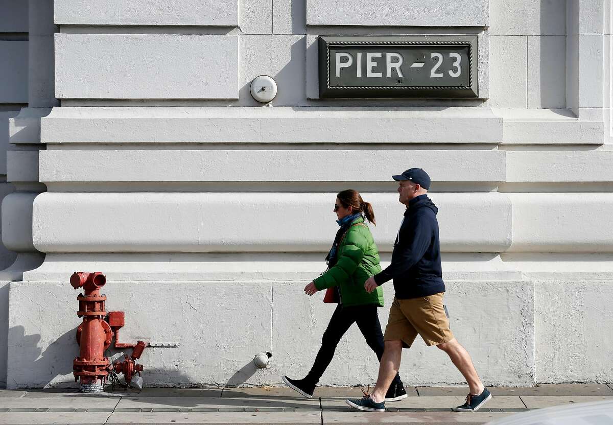 Pedestrians stroll past Pier 23 in San Francisco, Calif. on Wednesday, Nov. 15, 2017. Supervisor Aaron Peskin is floating an idea to open two homeless navigation centers at Pier 23 and on a parking lot at 88 Broadway.