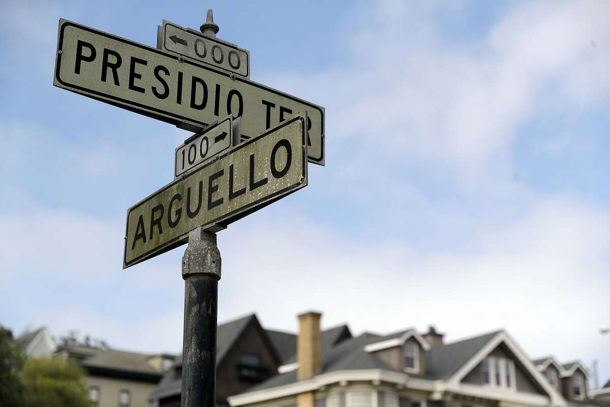 FILE - In this Aug. 7, 2017 file photo, street signs are seen at the intersection of Presidio Terrace and Arguello at the entrance to the Presidio Terrace neighborhood in San Francisco. Wealthy homeowners whose private, gated and very exclusive San Francisco street was auctioned off after decades of unpaid taxes are asking supervisors Monday, Nov. 27, 2017, to undo the sale, prompting cries of elitism in a city obsessed with property and fairness. (AP Photo/Marcio Jose Sanchez, File)