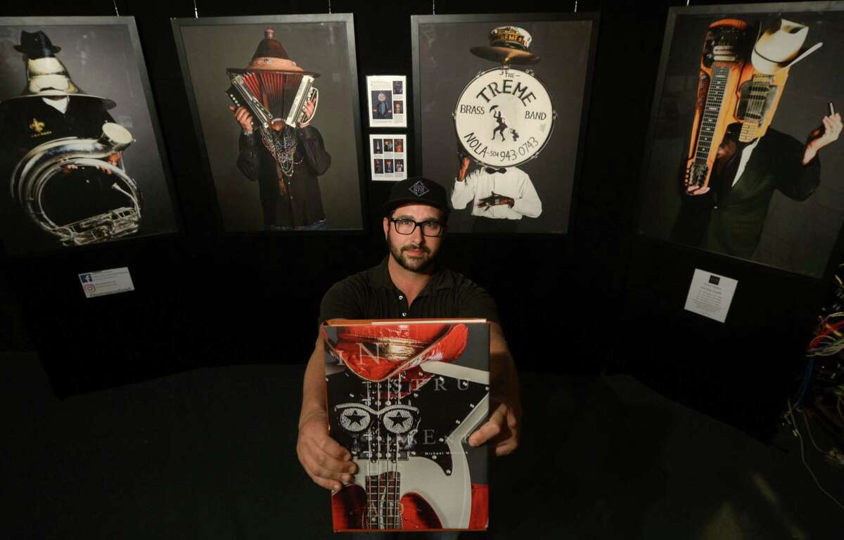 Photographer Michael Weintrob with his traveling exhibit supporting his book tour, Instrumenthead, which was published in April, at The Factory Underground on Friday in Norwalk.