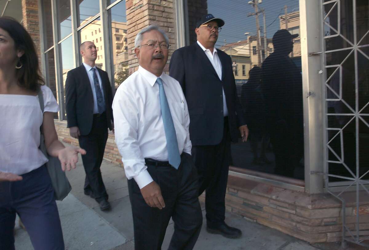 Mayor Ed Lee (middle) takes an outside street tour of the the latest Navigation Center, a one-stop comprehensive shelter aimed at quickly housing the homeless, on Sunday, July 16, 2017 in San Francisco, Calif.