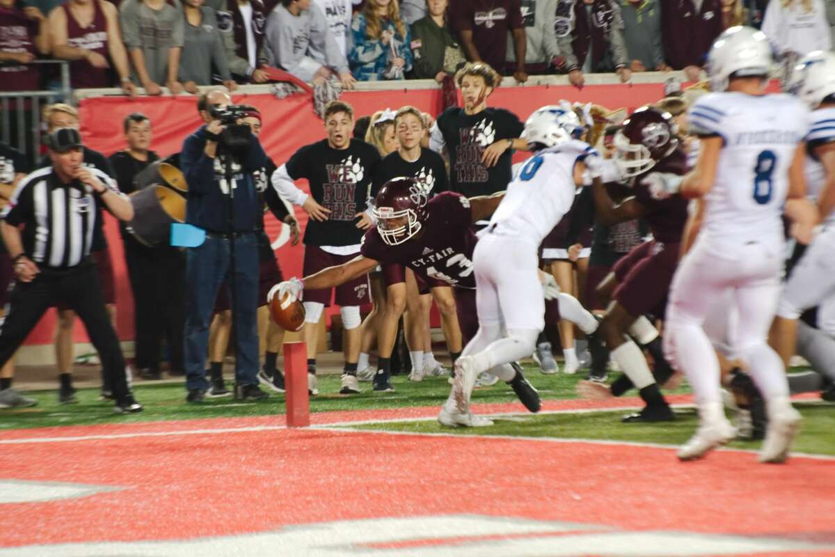 Cy-Fair's (43) Trenton Kennedy dives into the end zone for a touchdown against Friendswood Friday, Dec. 1. at University of Houston TDECU Stadium.