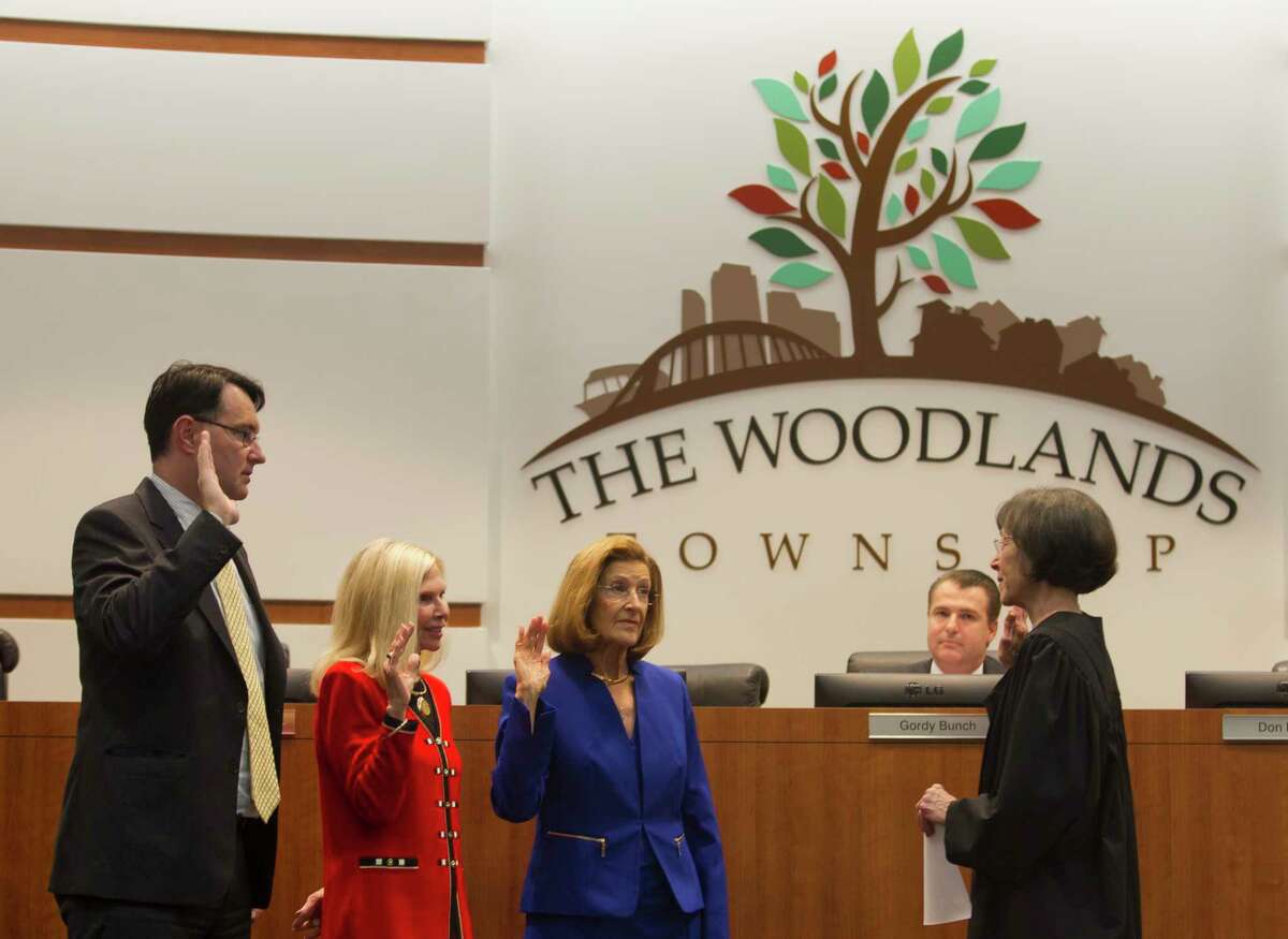 Newly elected board member Carol Stromatt, third from left, is swarn in beside Ann Snyder and John McMullan during a meeting of The Woodlands Township Board of Directors, Wednesday, Nov. 29, 2017, in The Woodlands.