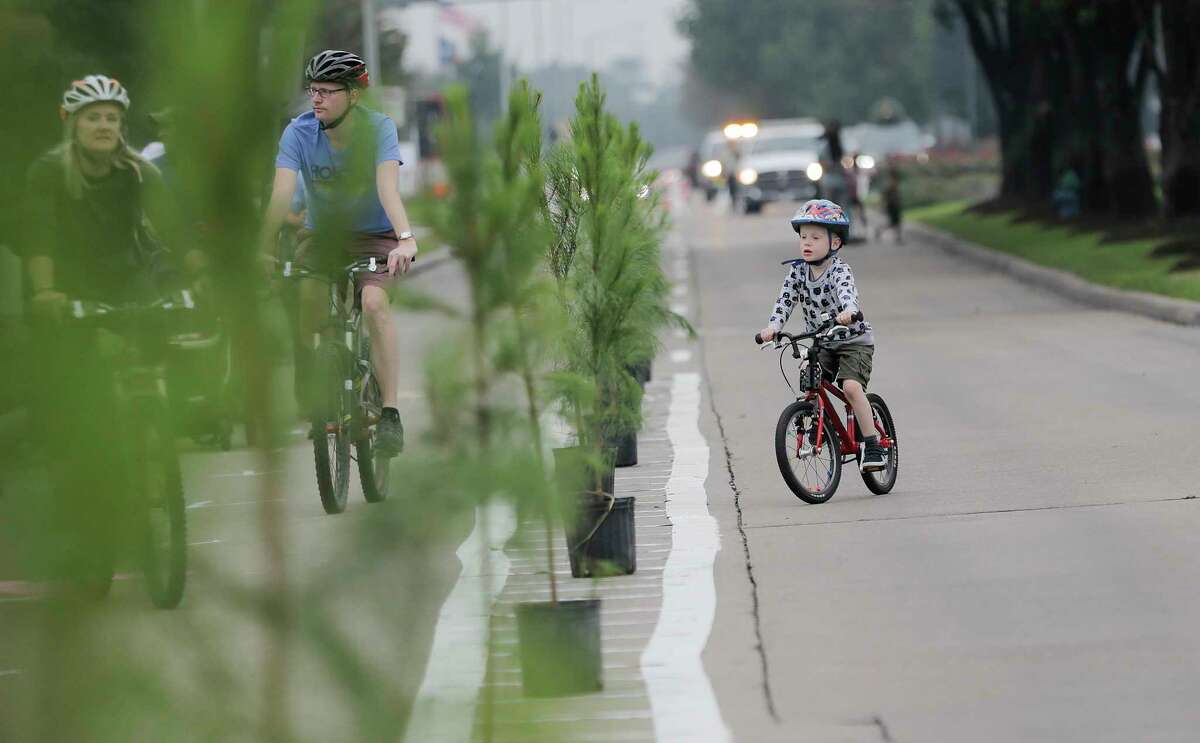 Trees divide a pop-up bike lane on Eldridge Parkway during the Cigna Sunday Streets on Sunday, Dec. 3, 2017, in Houston.