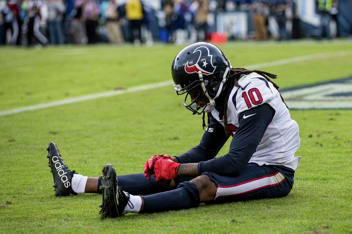 Houston Texans wide receiver DeAndre Hopkins (10) sits in the end zone after the Tom Savage pass intended for him was intercepted by Tennessee Titans cornerback LeShaun Sims during the fourth quarter of an NFL football game at Nissan Stadium on Sunday, Dec. 3, 2017, in Nashville. ( Brett Coomer / Houston Chronicle )