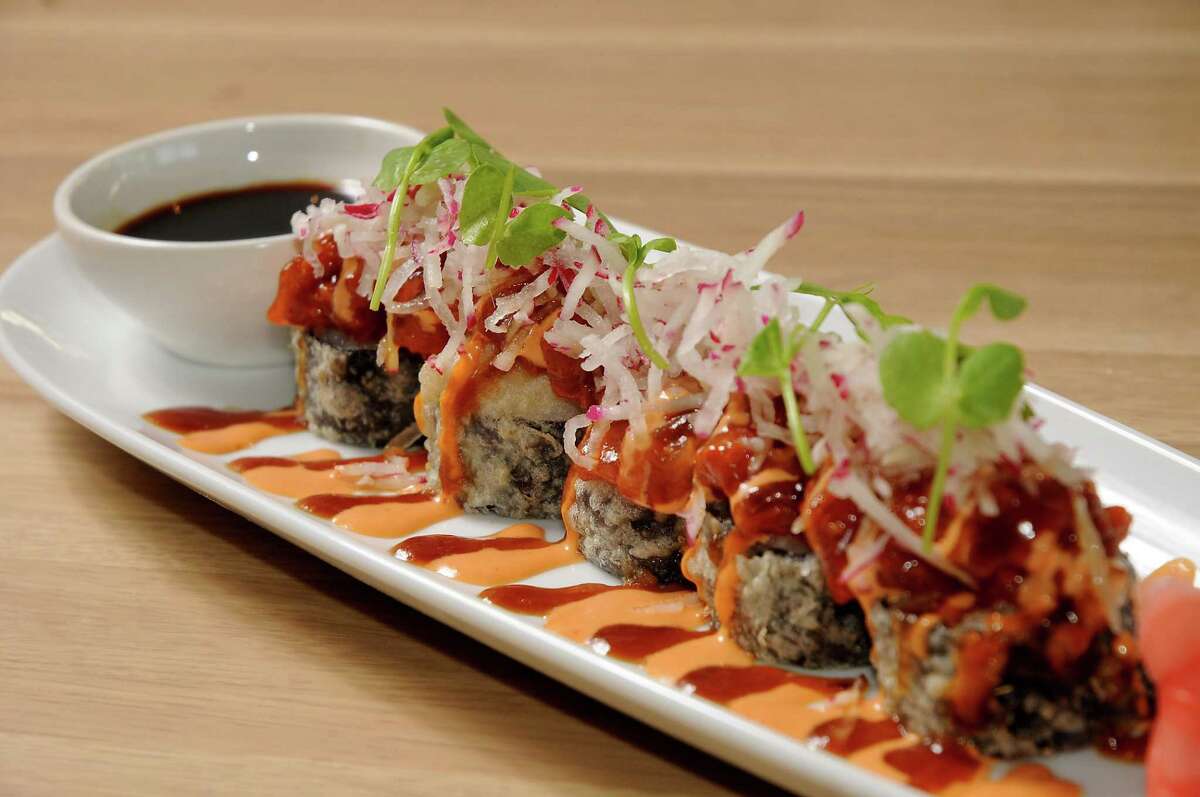 The spicy tuna roll-hand-rolled tempura sushi, spicy sushi grade ahi and soy sauce at Moxie's Grill & Bar on Westheimer.