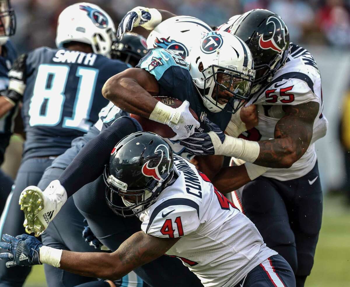 Houston Texans inside linebacker Zach Cunningham (41) and inside linebacker Benardrick McKinney (55) hit Tennessee Titans running back DeMarco Murray (29) at the line of scrimmage during the third quarter of an NFL football game at Nissan Stadium on Sunday, Dec. 3, 2017, in Nashville.