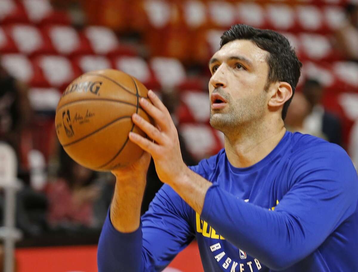 Golden State Warriors center Zaza Pachulia (27) shoots during warmups before the Warriors played against the Miami Heat in an NBA basketball game, Sunday, Dec. 3, 2017, in Miami. (AP Photo/Joe Skipper)