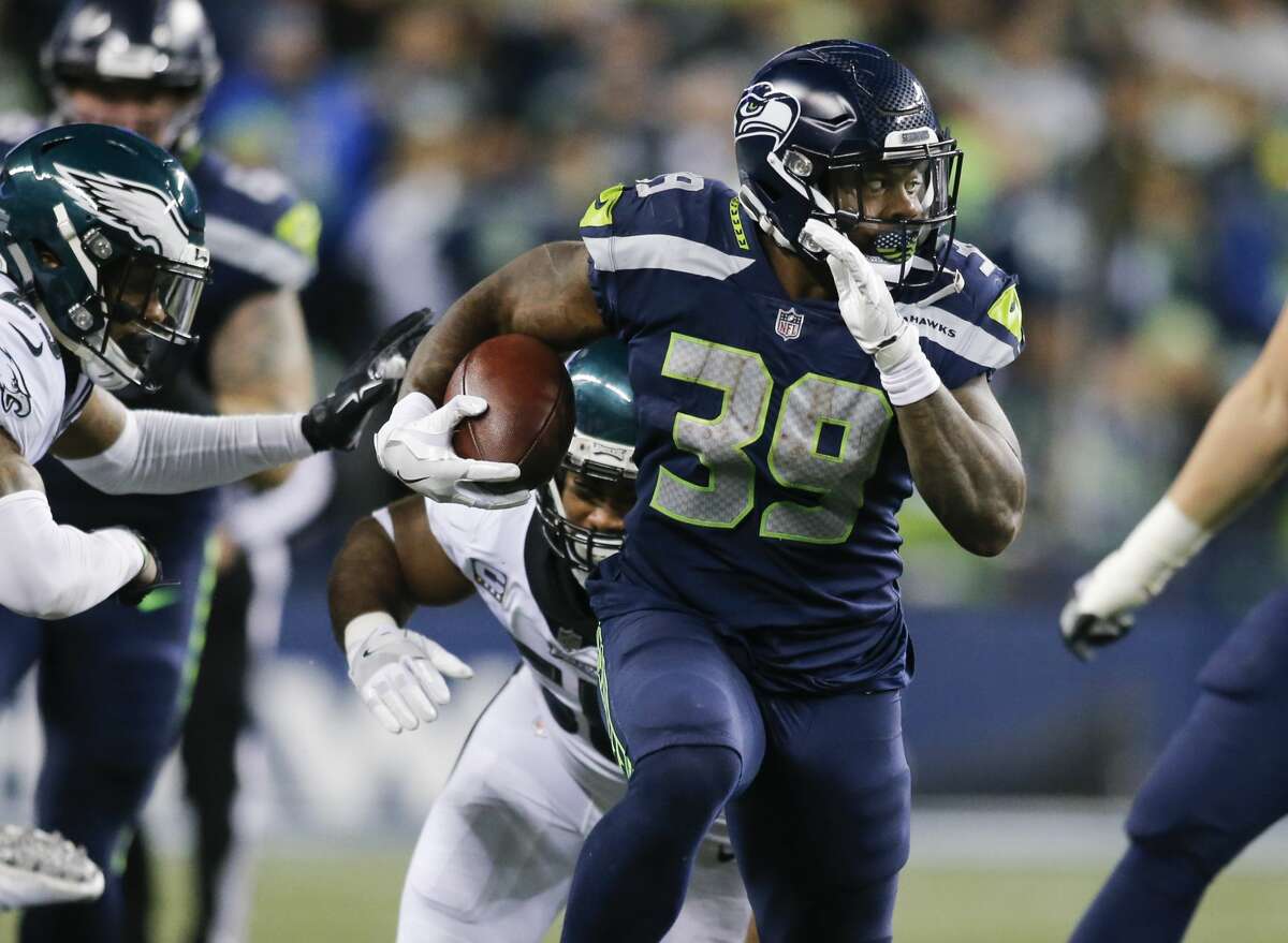 SEATTLE, WA - DECEMBER 03: Running back Mike Davis #39 of the Seattle Seahawks rushes against the Philadelphia Eagles in the fourth quarter at CenturyLink Field on December 3, 2017 in Seattle, Washington. (Photo by Jonathan Ferrey/Getty Images)