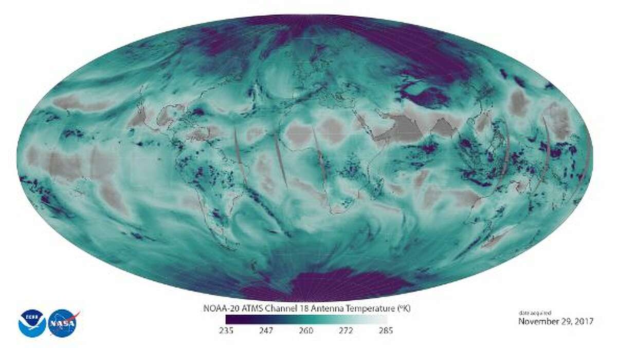 "This image uses ATMS data to depict the location and abundance of water vapor (as associated with antenna temperatures) in the lower atmosphere, from the surface of the Earth  to 5 kilometers altitude. Transparent/grey colors depict areas with less water vapor, while blue-green and purple colors represent abundant water in all phases (vapor, clouds, and precipitation) in low and middle latitudes. In the polar regions, purple depicts surface snow and ice." -NOAA