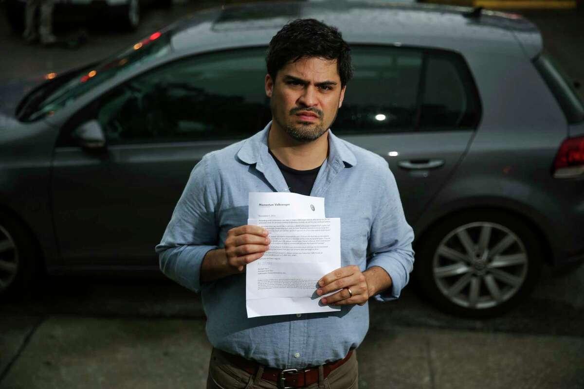 Dr. Ricardo Nuila, an assistant professor of medicine with Baylor University, holds a letter that notified him in November 2015 that his Golf TDI was part of the emissions scandal that hit Volkswagen.