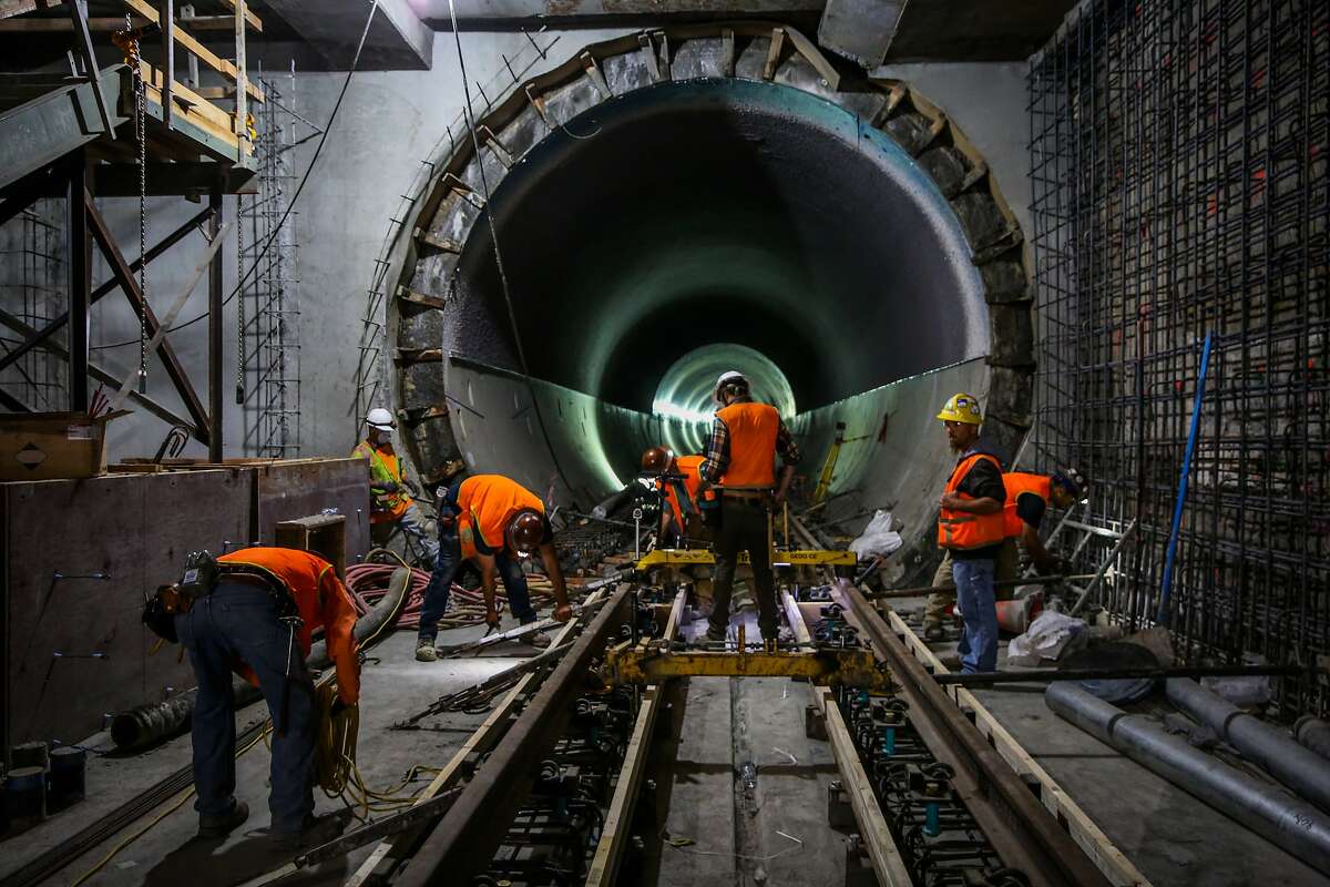 Workers do construction on the central subway at the Moscone station in San Francisco, Calif., on Wednesday, Sept. 13, 2017.