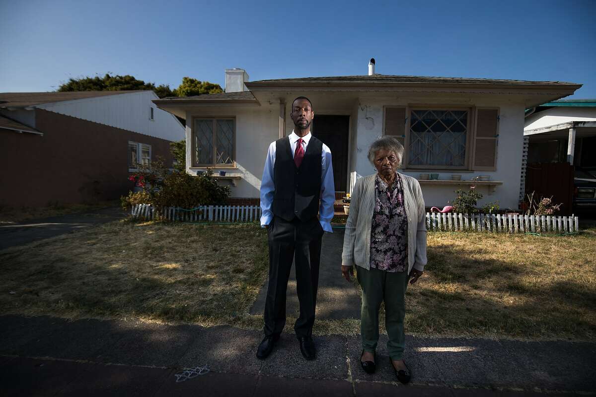 Omar Taylor and his aunt Dorothy DeBose, 77, in front of her foreclosed home on Thursday, July 27, 2017 in Oakland, CA.