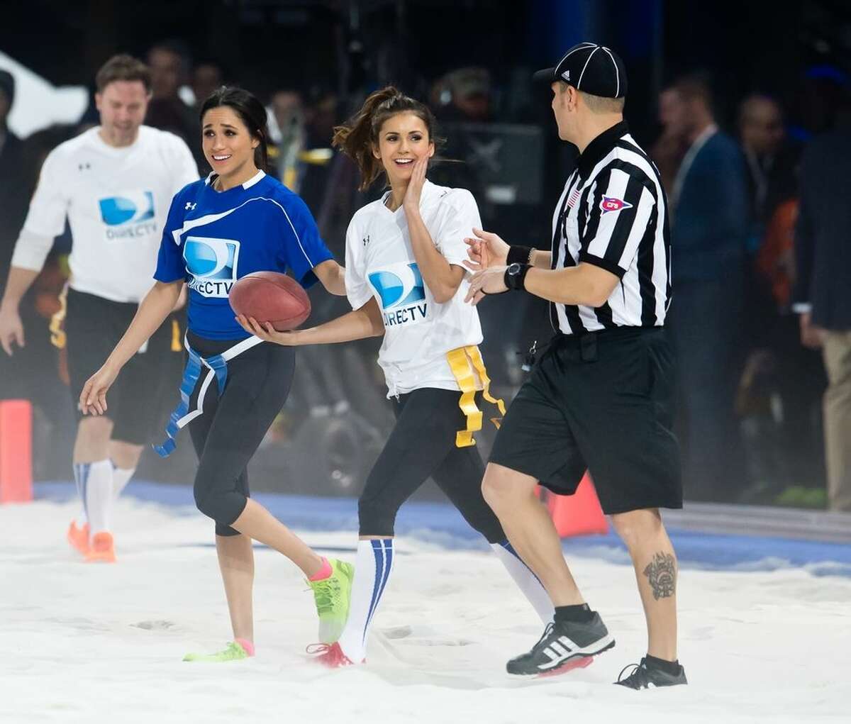 Meghan Markle With Nina Dobrev, participating in the DirecTV Beach Bowl in 2014.